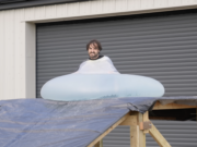 Man rolls downhill in giant water balloon in glorious slow motion
